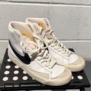 Nike White High-Top Sneakers with Black Swoosh and Cream Accents